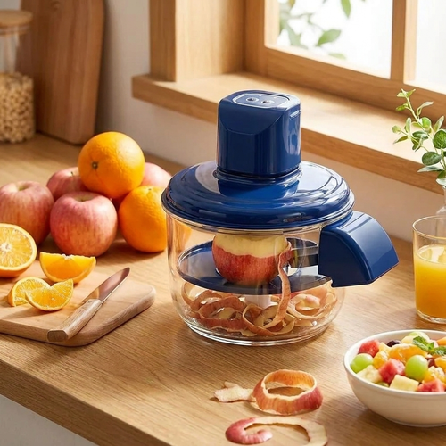 Electric peeler peeling apple — lifestyle