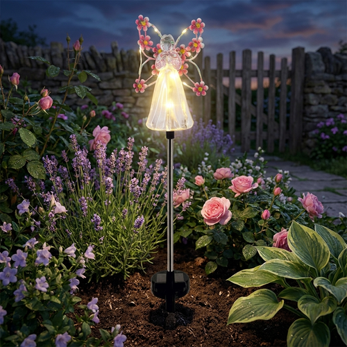 Solar angel garden stake glowing at twilight — lifestyle