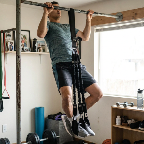 Pull-up assist band on gym bar — lifestyle