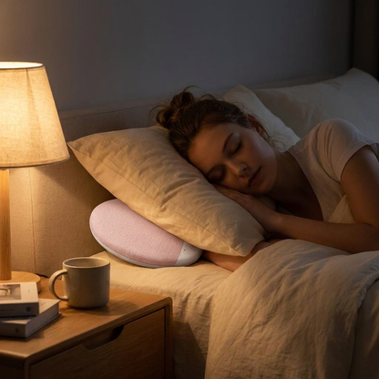 Pillow speaker beside sleeping head — lifestyle