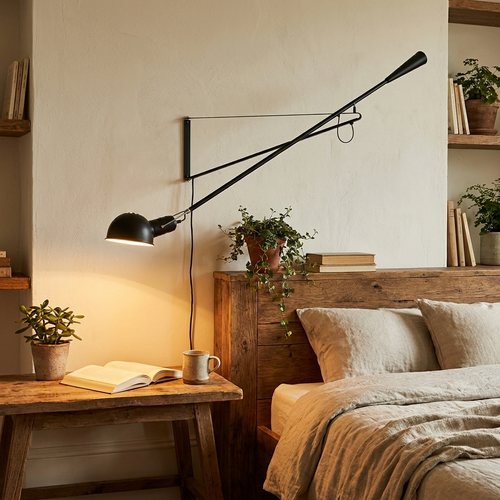 Adjustable wall lamp in cozy reading nook — lifestyle
